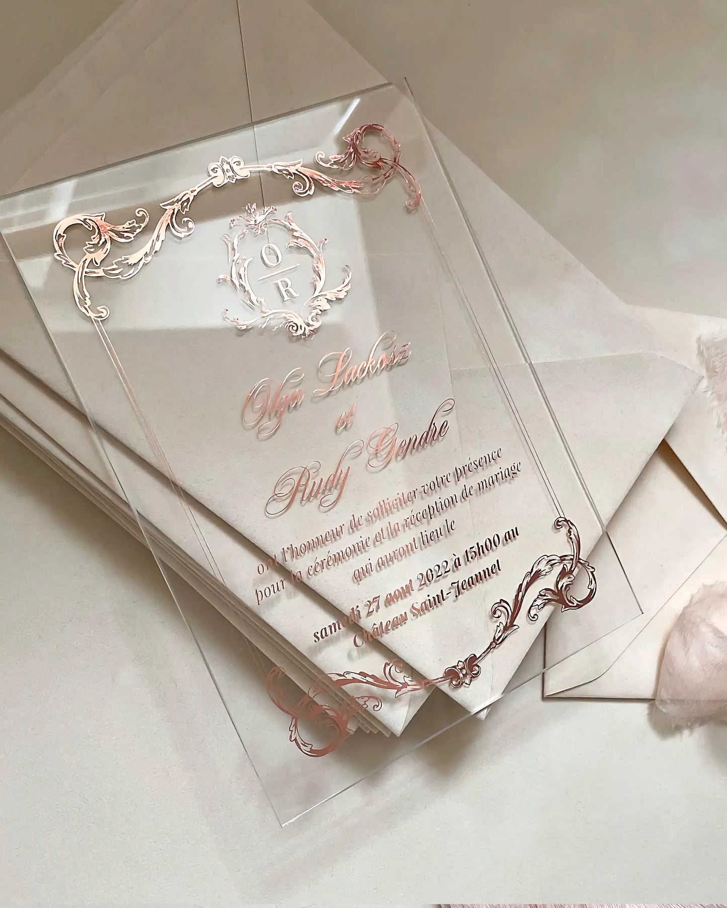 Isabelle Acrylic Wedding Invitations with rose gold baroque frame and monogram crest — Polina Perri
