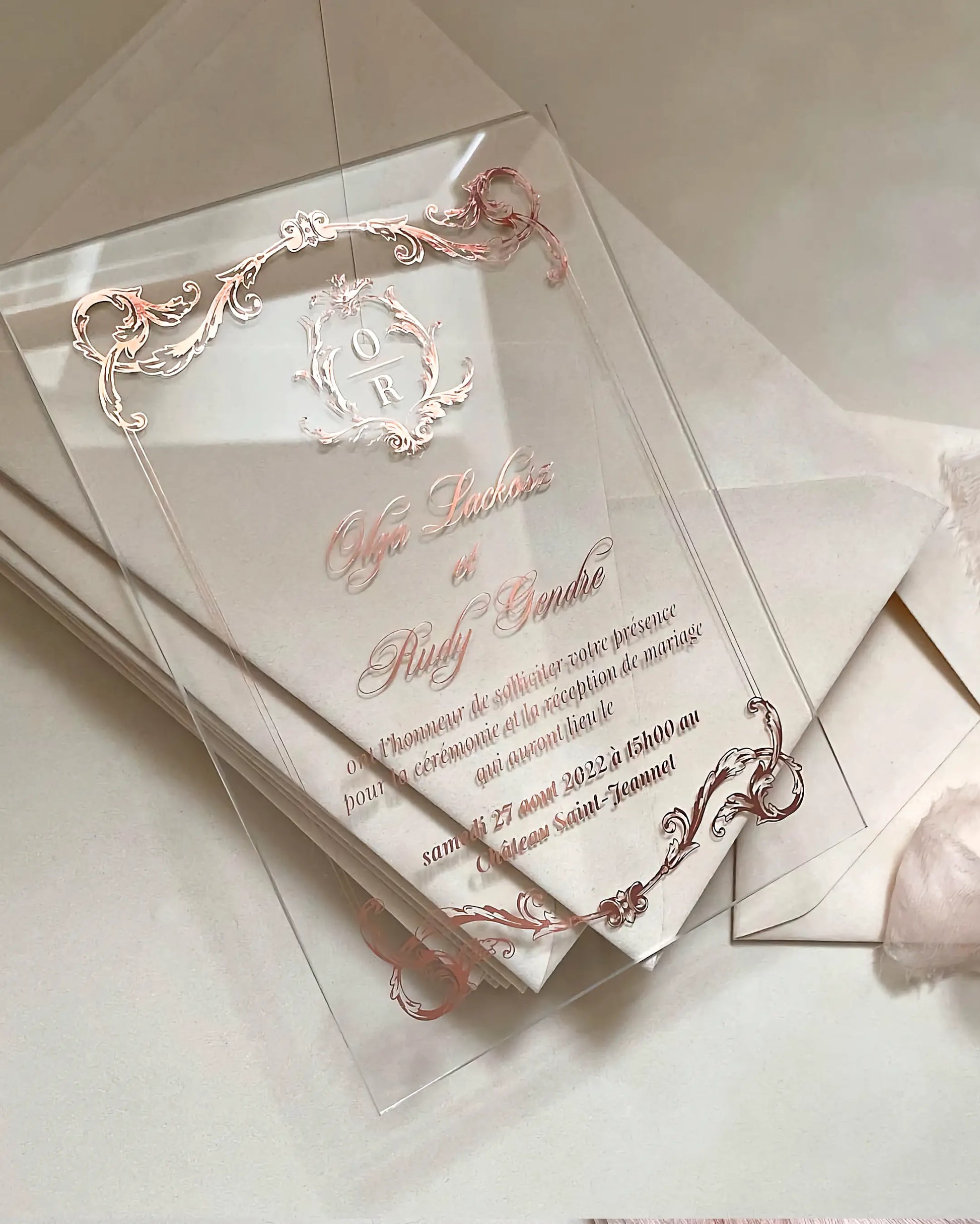 Isabelle Acrylic Wedding Invitations with rose gold baroque frame and monogram crest — Polina Perri