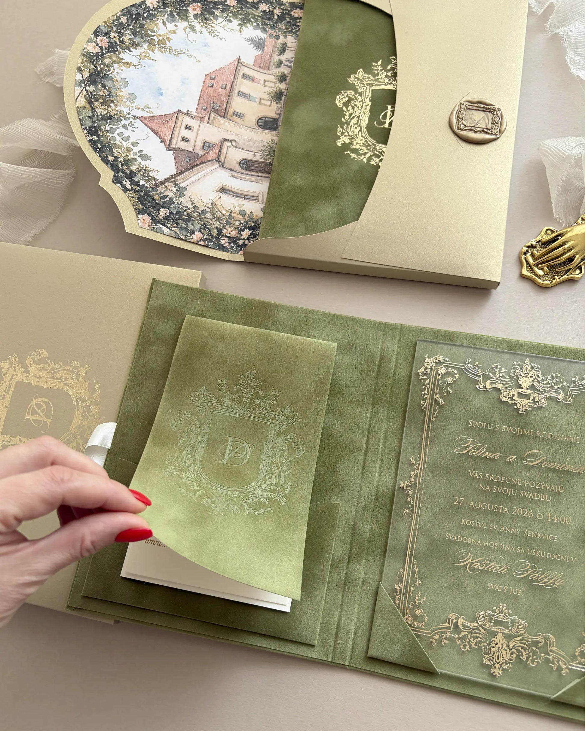 Heraldic Chic Moss Velvet Folio open showing embossed heraldic crest cover and cream invitation card — Polina Perri