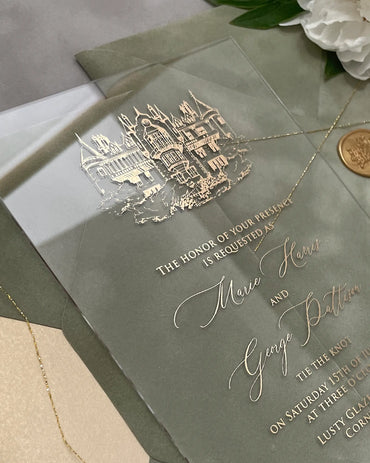 Venue Acrylic Wedding Invitation close-up with gold foil castle illustration and script wording — Polina Perri