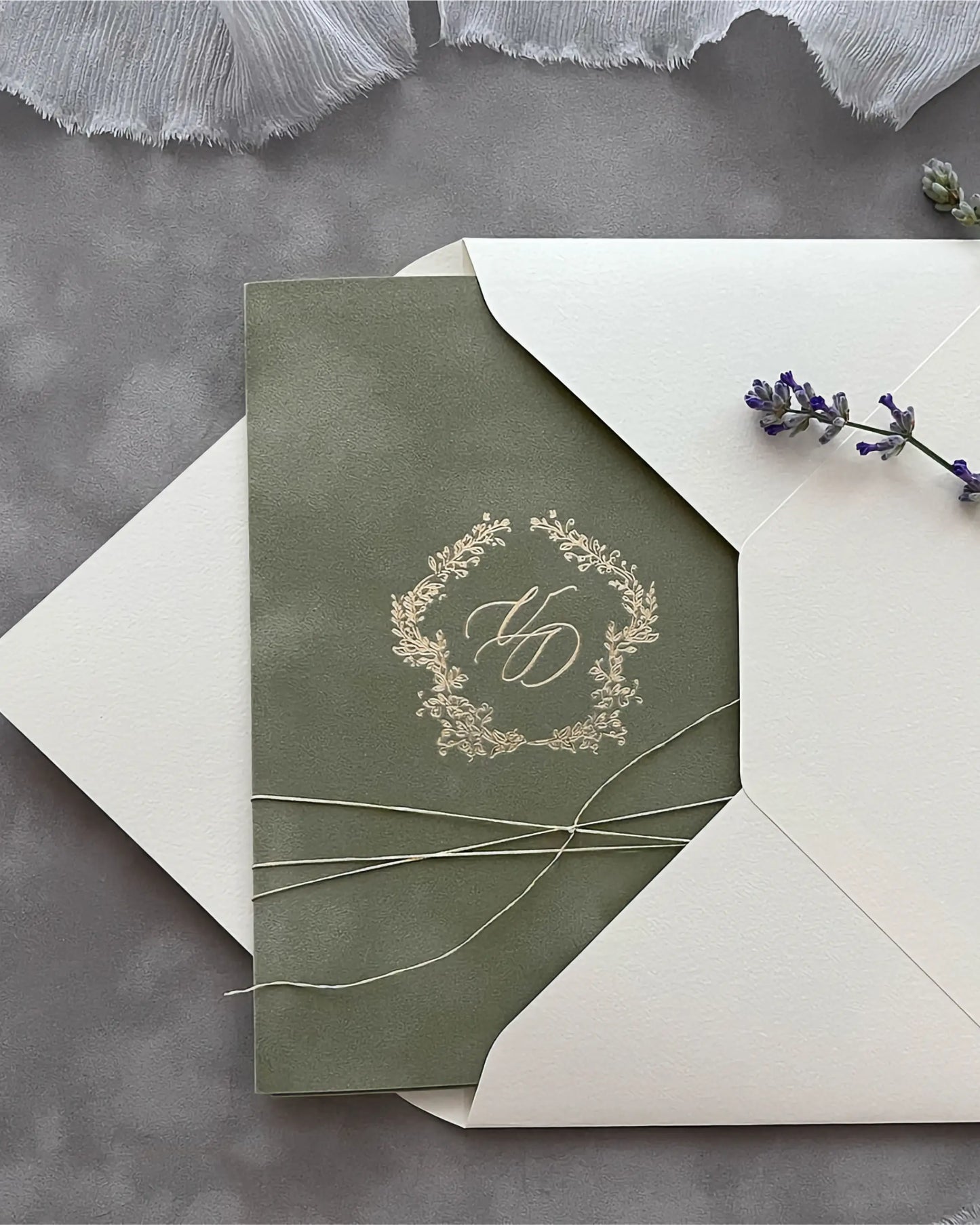 Virginie Sage Green velvet pocketfold wedding invitation with gold foil monogram and cream envelope — Polina Perri