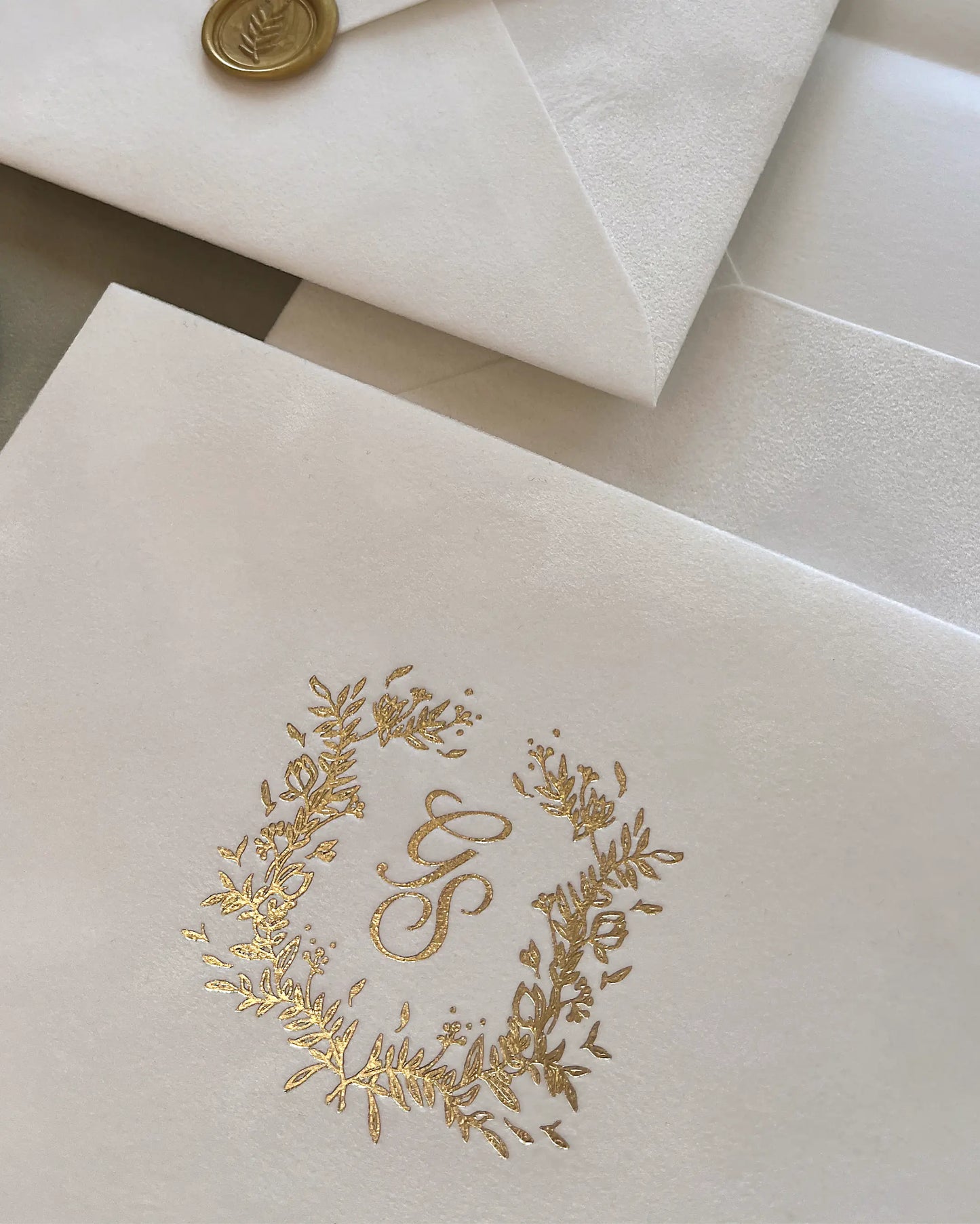 White Velvet Envelope close-up with gold foil wreath monogram and wax seal — Polina Perri