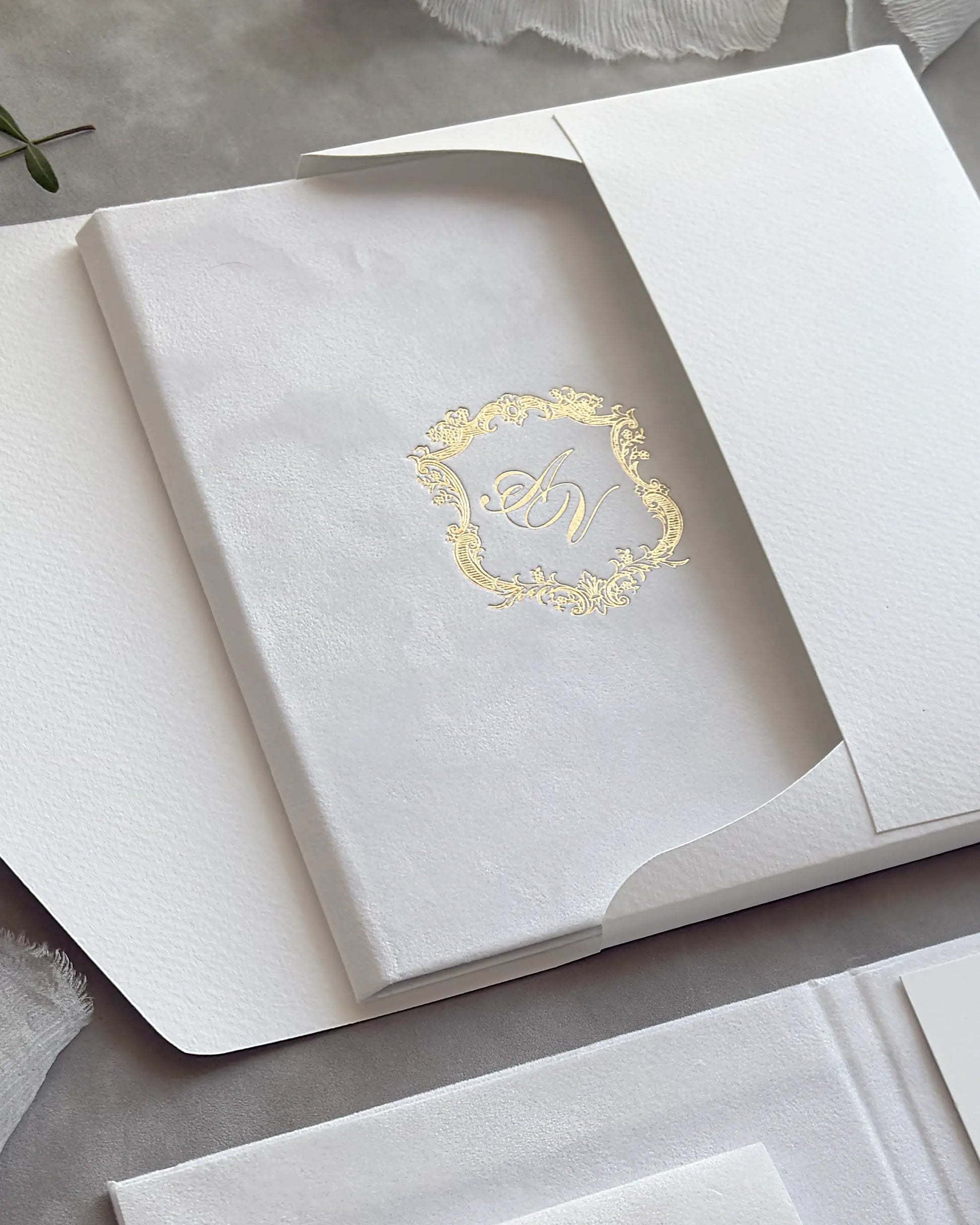 White Velvet Royal Style Folio cover with gold foil monogram crest close-up — Polina Perri