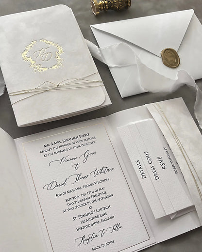 Virginie White velvet pocketfold wedding invitation with gold monogram, envelope and wax seal — Polina Perri