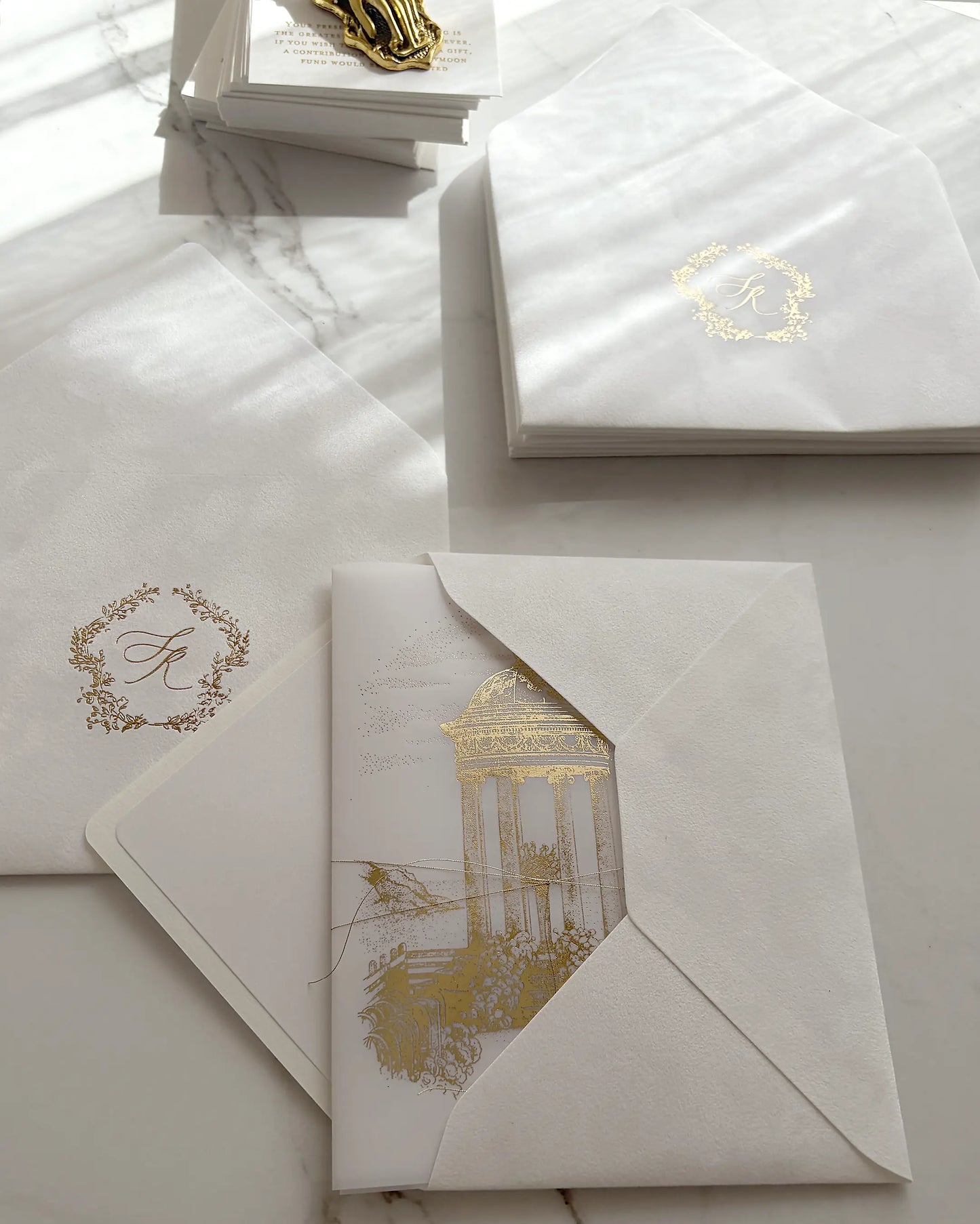 Belvedere luxury destination wedding invitations showcasing premium velvet inner envelopes with gold foil monogram and outer paper envelopes Polina Perri