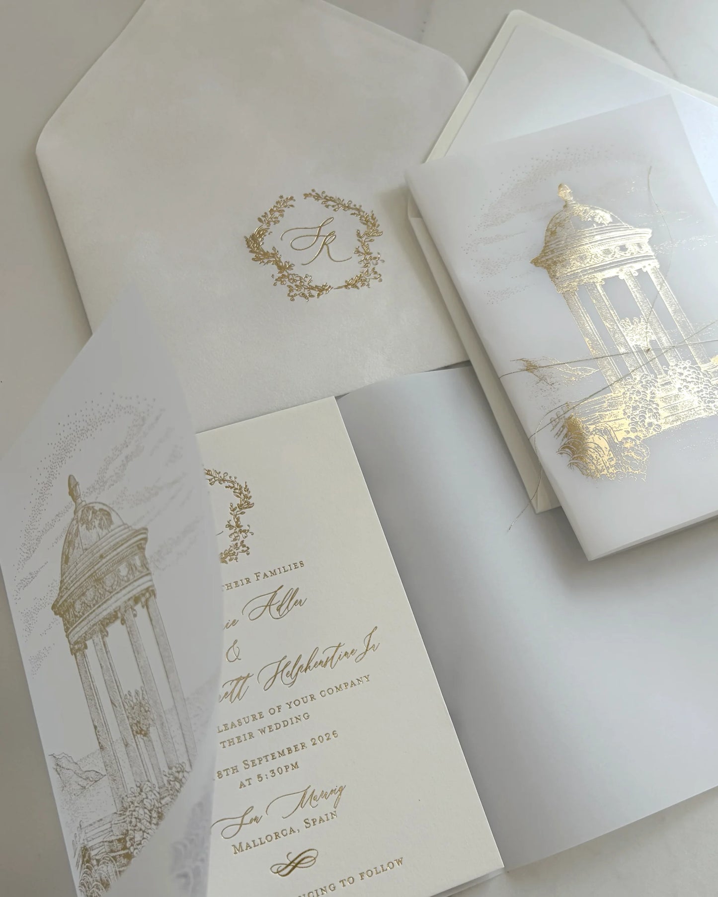 Belvedere luxury destination wedding invitations with gold foil tri fold vellum wrap elegant foil pressed cotton card and monogrammed innervelvet envelope Polina Perri