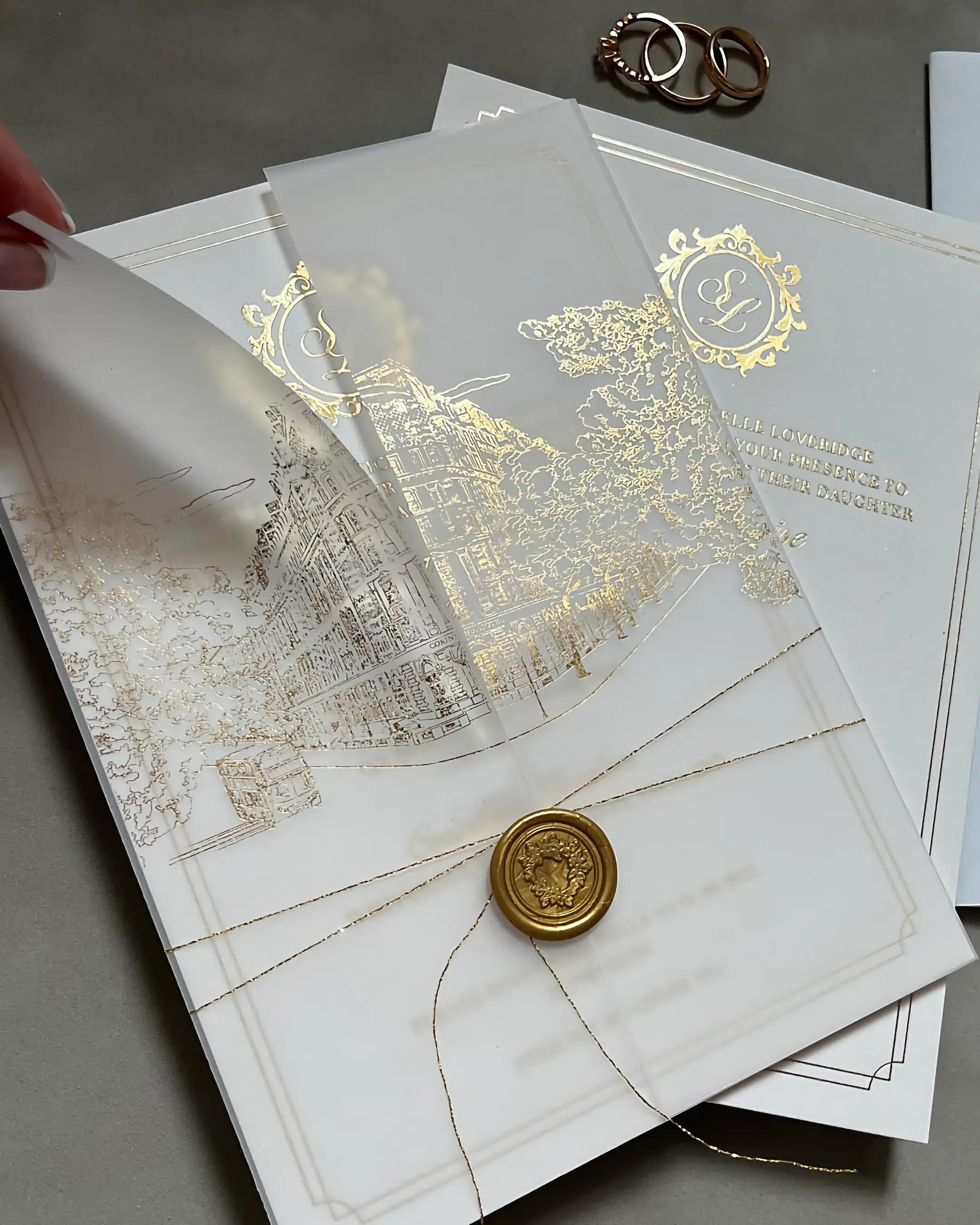 Corinthia XL gold foil wedding invitation with an intricate venue illustration on thick cotton paper, enclosed in a gatefold vellum jacket with gold string and wax seal — Polina Perri