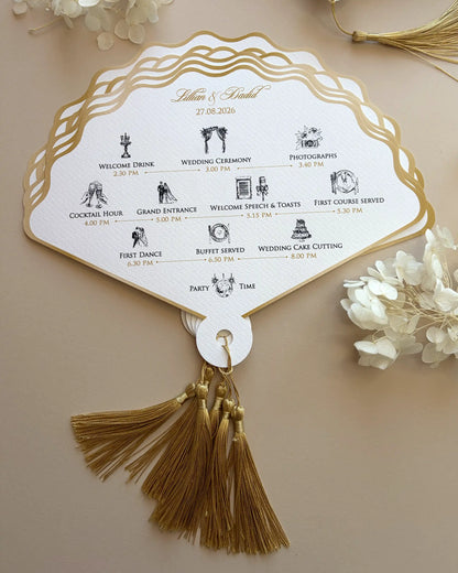 A luxury fan-shaped wedding order of the day printed on cream paper, featuring intricate event timeline icons, elegant gold foil edges, and a decorative gold tassel — Polina Perri