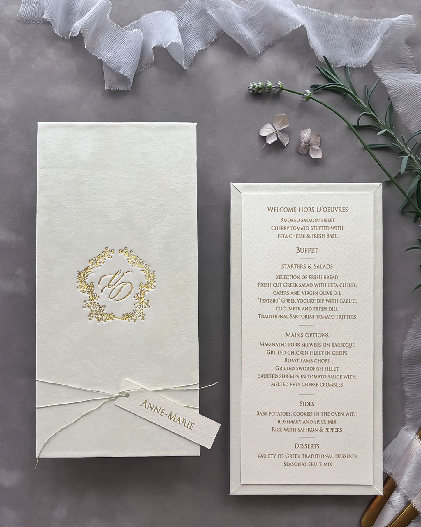 Sophisticated cream velvet wedding menu board styled with an elegant gold foil monogram cover and a fine textured paper course checklist — Polina Perri