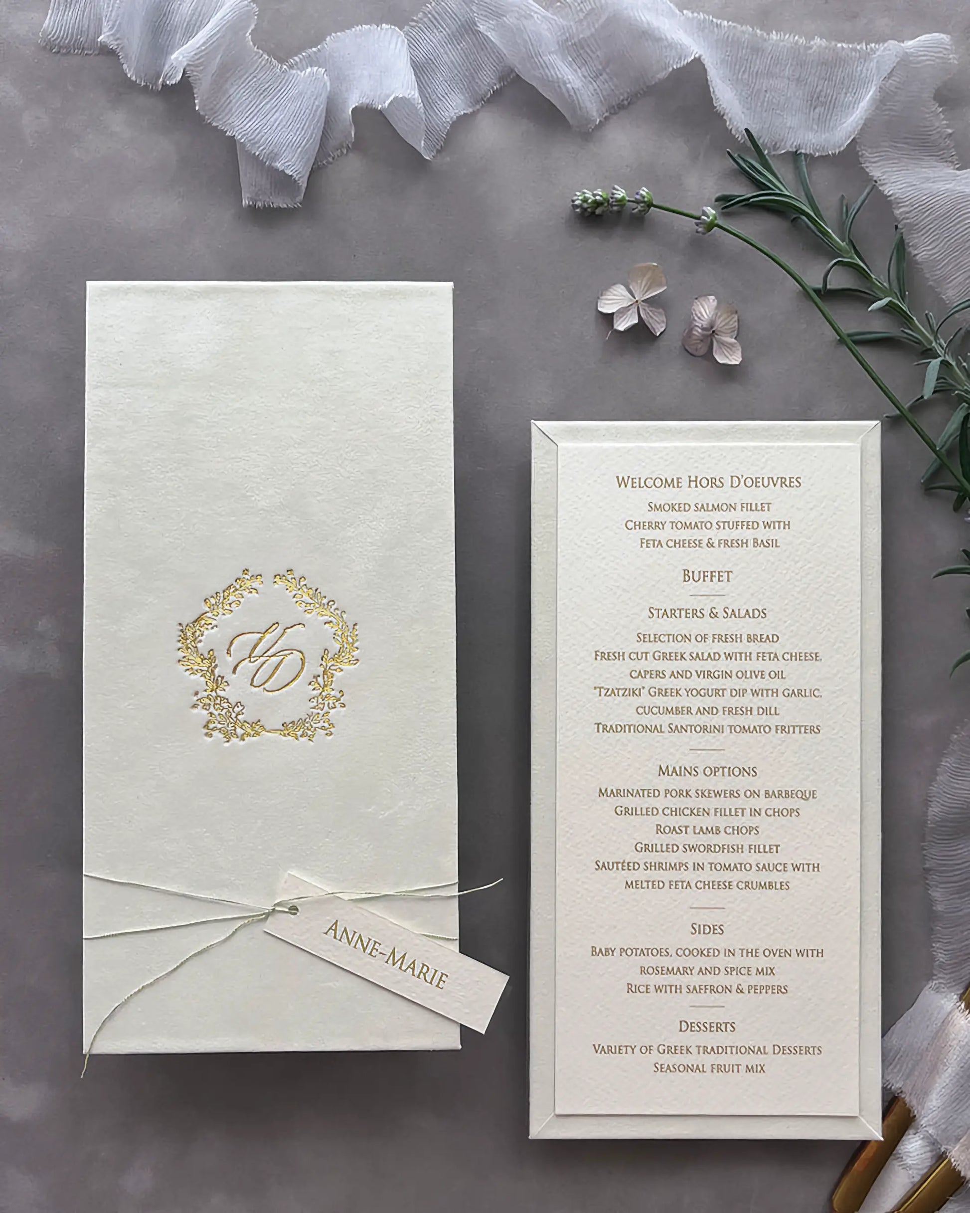 Sophisticated cream velvet wedding menu board styled with an elegant gold foil monogram cover and a fine textured paper course checklist — Polina Perri