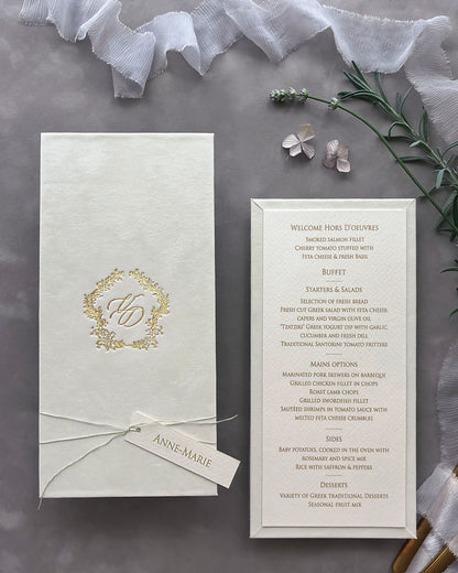 Sophisticated cream velvet wedding menu board styled with an elegant gold foil monogram cover and a fine textured paper course checklist — Polina Perri