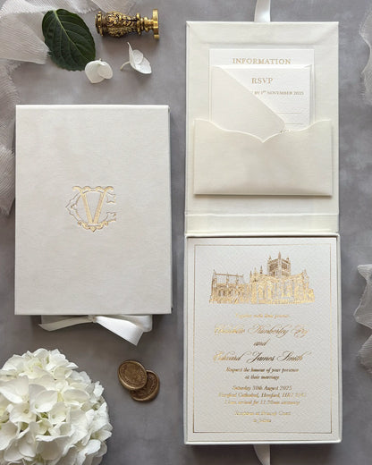 Premium wedding invitation suite in a cream velvet box featuring a custom gold foil venue illustration on luxury heavy paper stock — Polina Perri