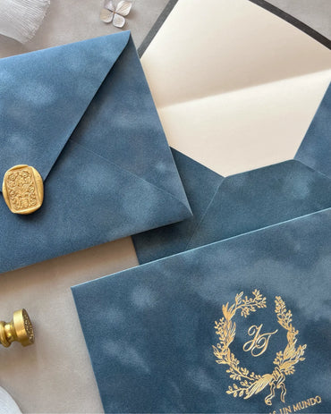 Dusty Blue Velvet Wedding Envelopes with gold wax seal and foil-stamped wreath monogram — Polina Perri