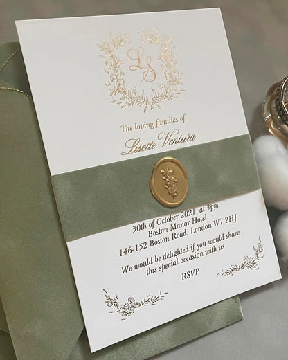 Elegant floral gold foil wedding invitation card decorated with a matching sage green velvet belly band and a custom embossed gold wax seal — Polina Perri