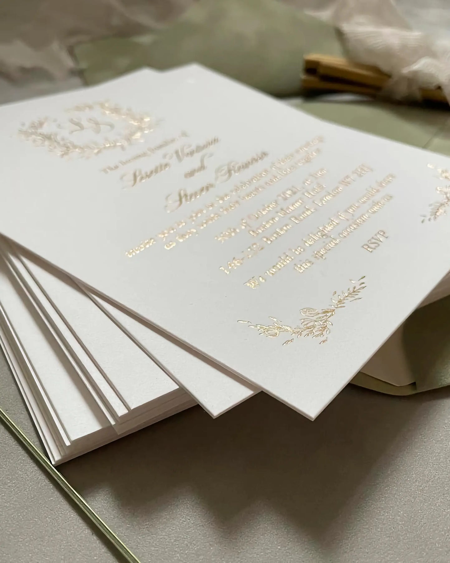 A stacked arrangement of luxury Fiori wedding invitations, showcasing the clean edges and heavy texture of the ultra-thick 600gsm cotton card stock — Polina Perri