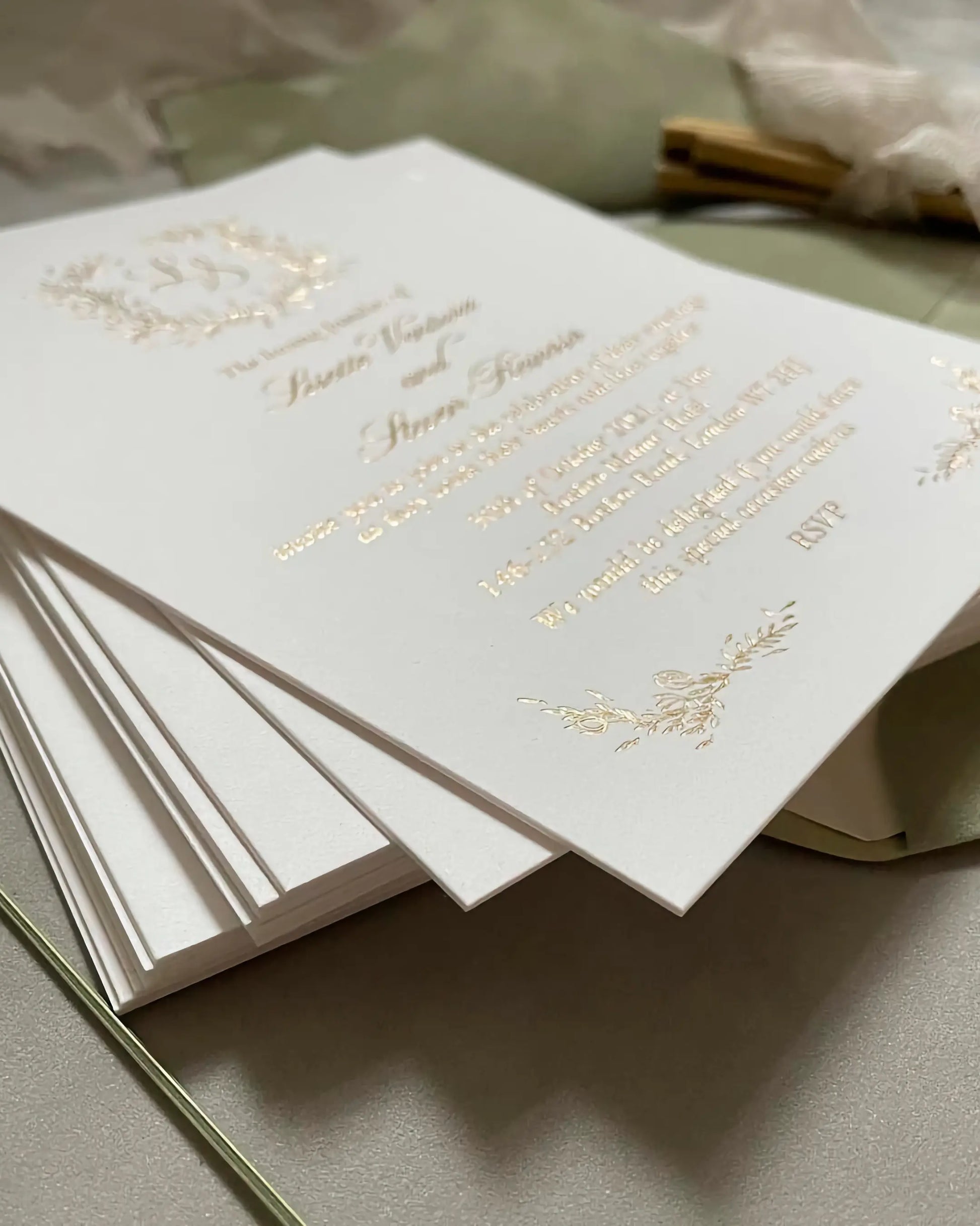 A stacked arrangement of luxury Fiori wedding invitations, showcasing the clean edges and heavy texture of the ultra-thick 600gsm cotton card stock — Polina Perri