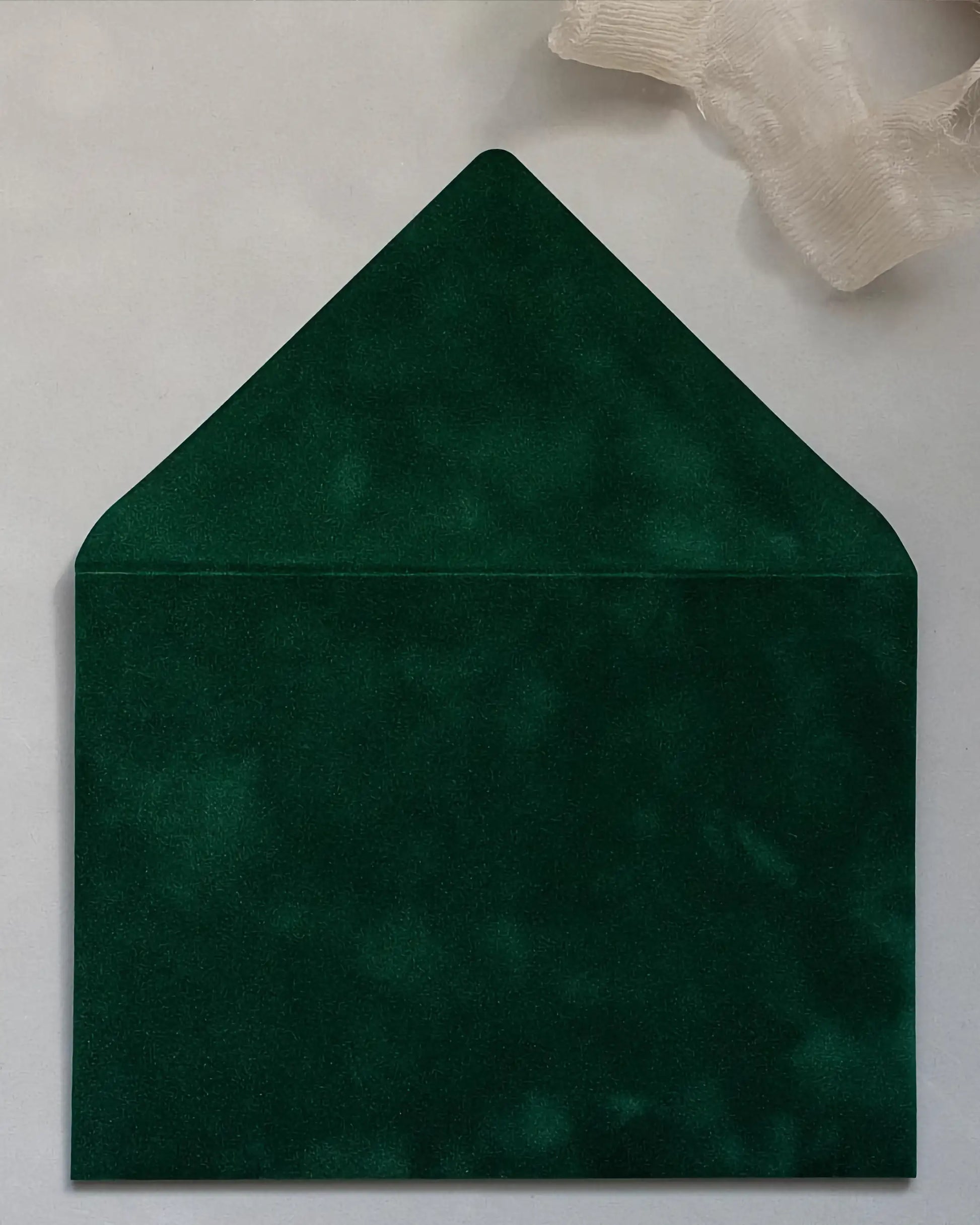 Forest Green velvet envelope flat lay close-up — Polina Perri
