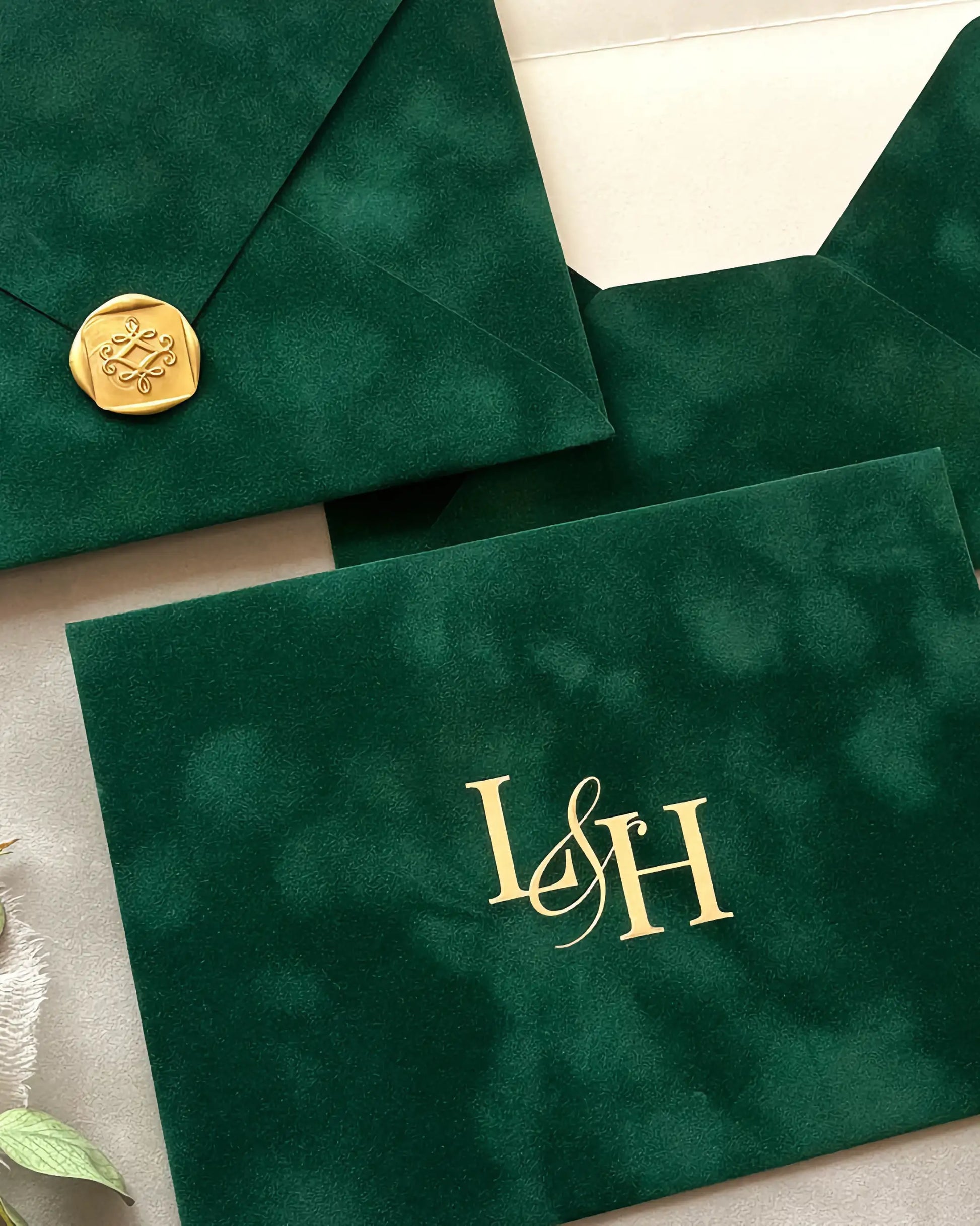 Forest Green velvet envelopes with gold wax seal and foil monogram close-up — Polina Perri