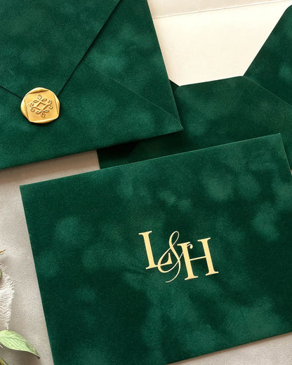 Forest Green velvet envelopes with gold wax seal and foil monogram close-up — Polina Perri