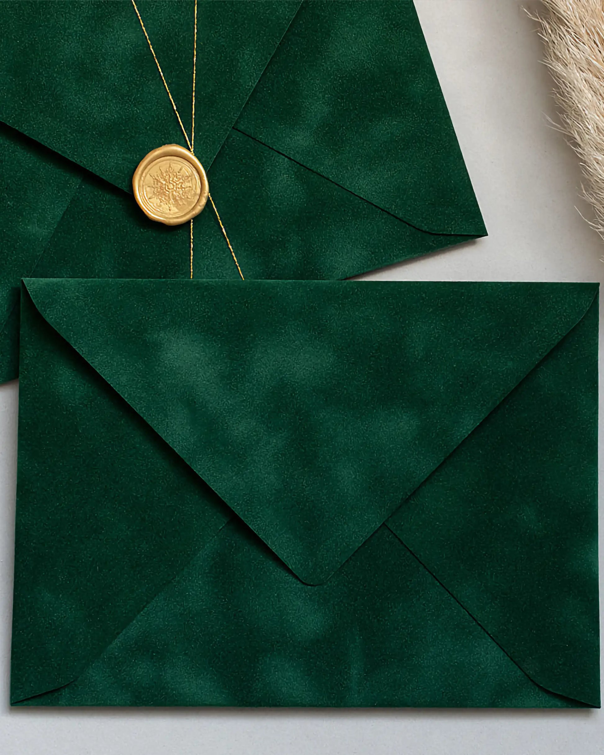Forest Green velvet envelopes with gold wax seal and gold string close-up — Polina Perri