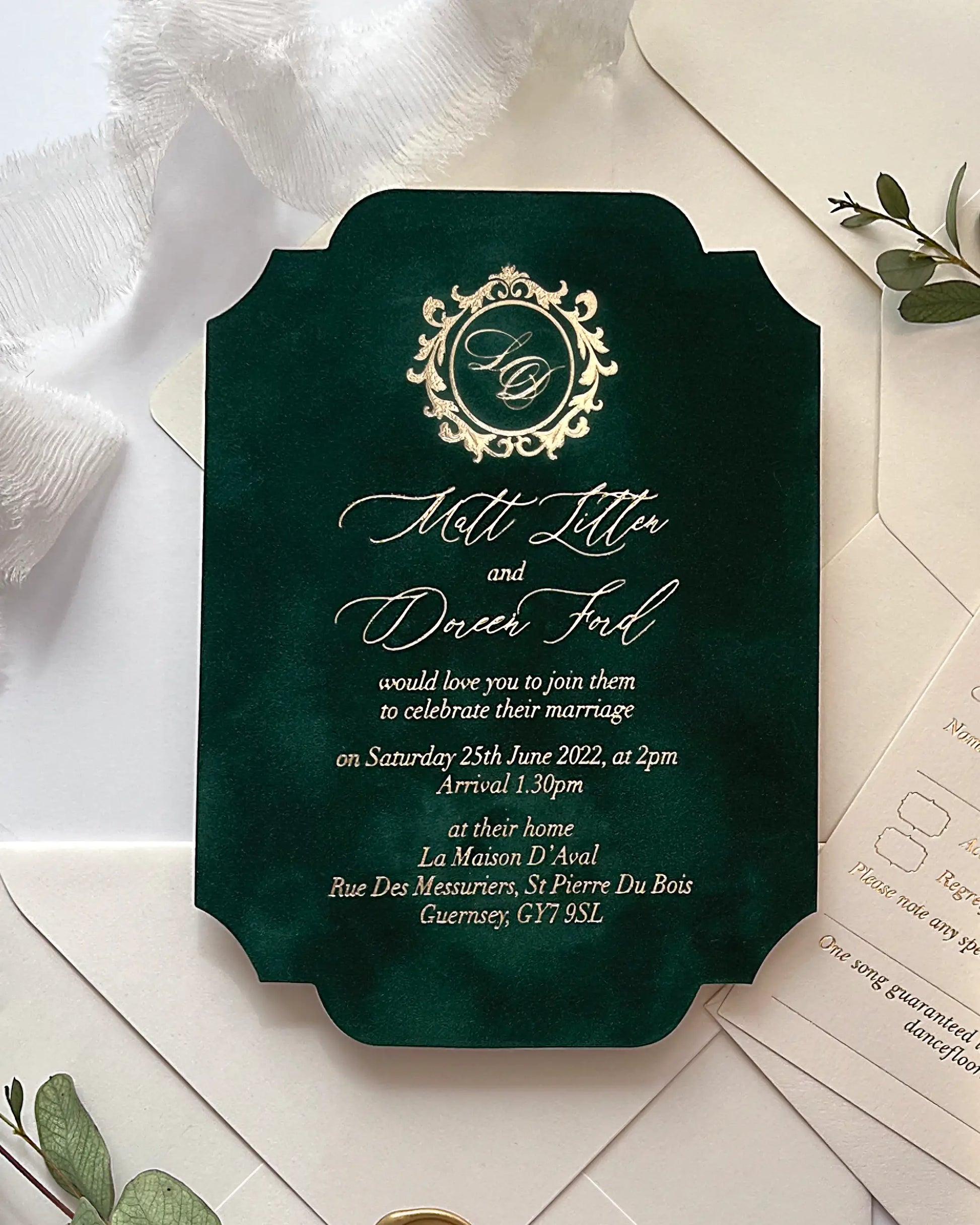Premium forest green velvet wedding invitation card with unique curved die-cut corners, gold foil script calligraphy, and a wax sealed envelope — Polina Perri