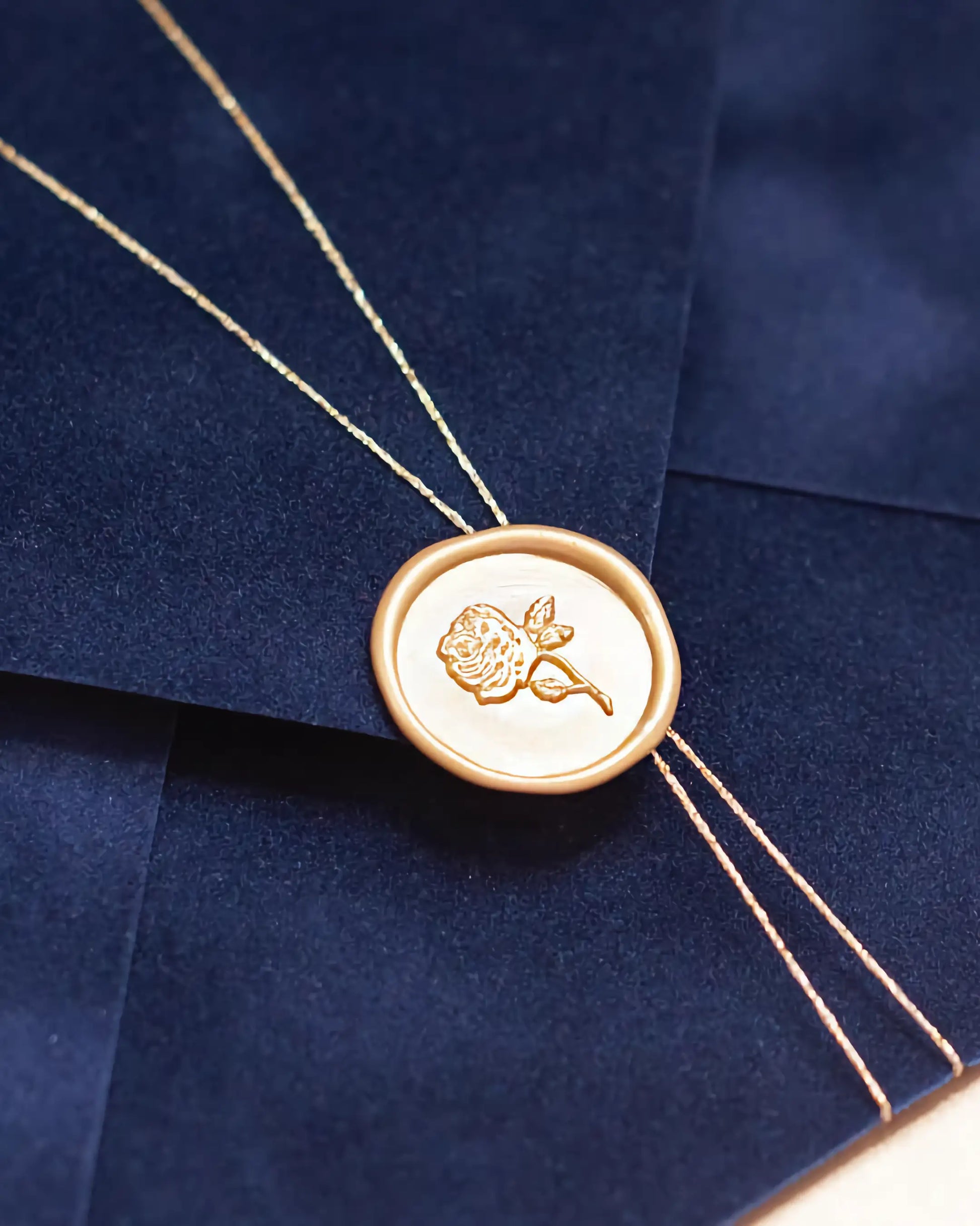 Gold Roses Acrylic wedding invitation Navy Blue velvet envelope close-up with gold rose wax seal — Polina Perri