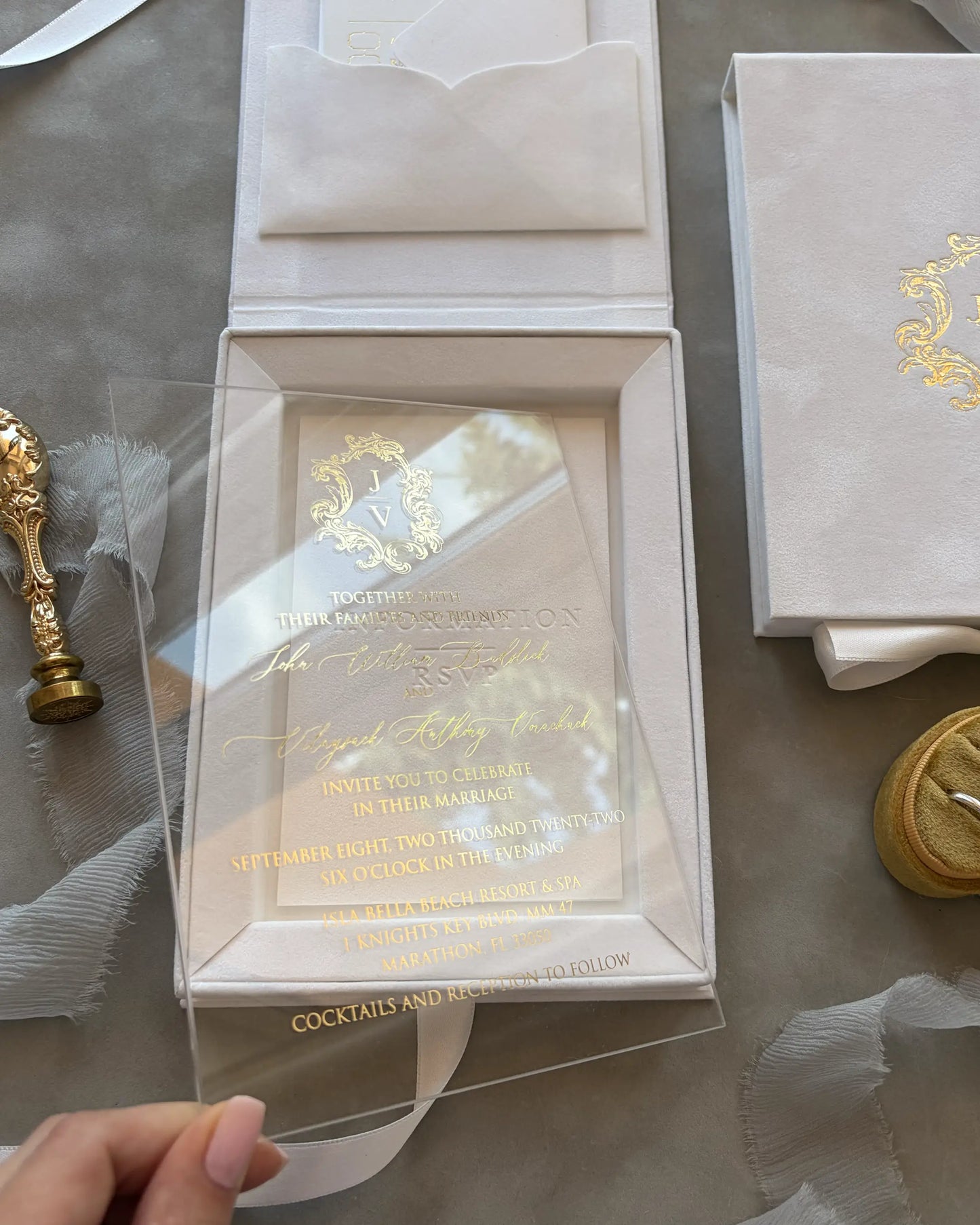 White Velvet Boxed Hampton Manor wedding invitation card by Polina Perri, textured white paper card with gold foil stamped venue illustration of Hampton Manor close up