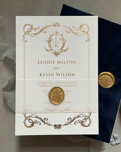 Isabelle gold foil wedding invitation suite secured with a translucent vellum belly band and a detailed gold monogram wax seal — Polina Perri