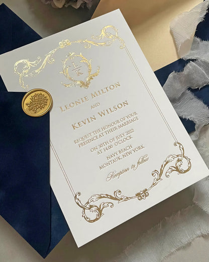 Angled shot of the Isabelle luxury wedding invitation highlighting the reflective metallic gold foil stamping on thick ivory cotton paper — Polina Perri