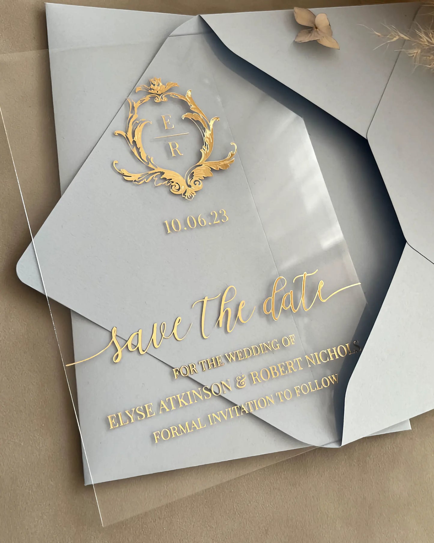 Isabelle Save the Date clear acrylic card with gold foil crest and cream envelope — Polina Perri