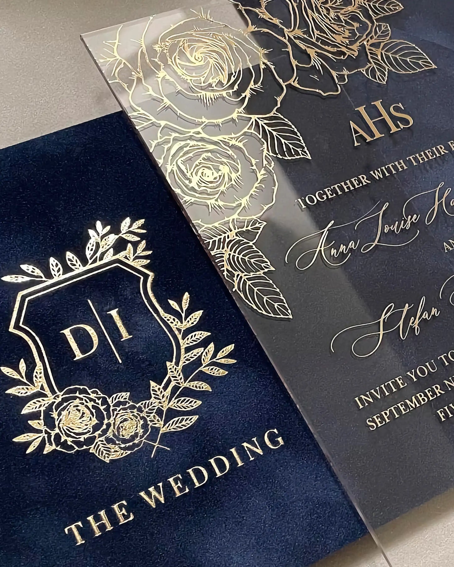 Gold Roses Acrylic wedding invitation close-up with gold foil rose corner detail and monogram crest — Polina Perri