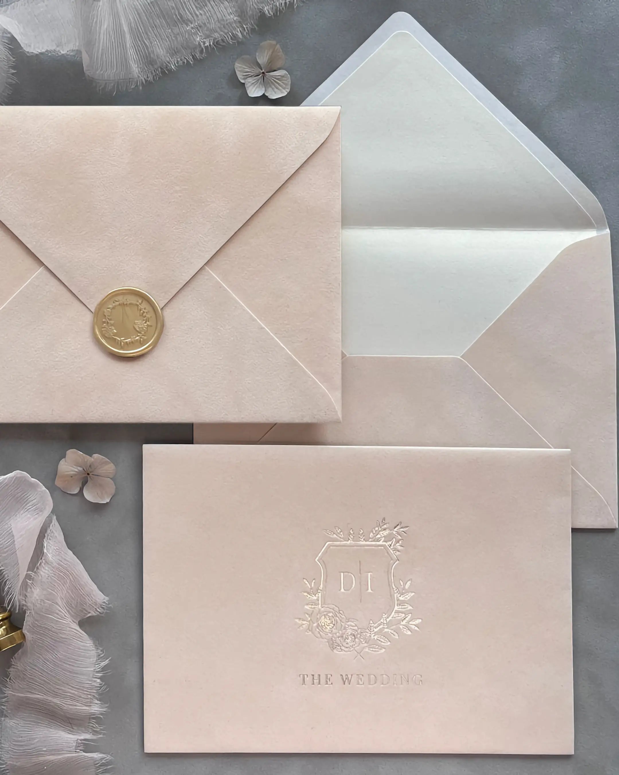Blush Velvet Paper Wedding Envelopes with cream shimmer liner, gold wax seal and embossed monogram card — Polina Perri