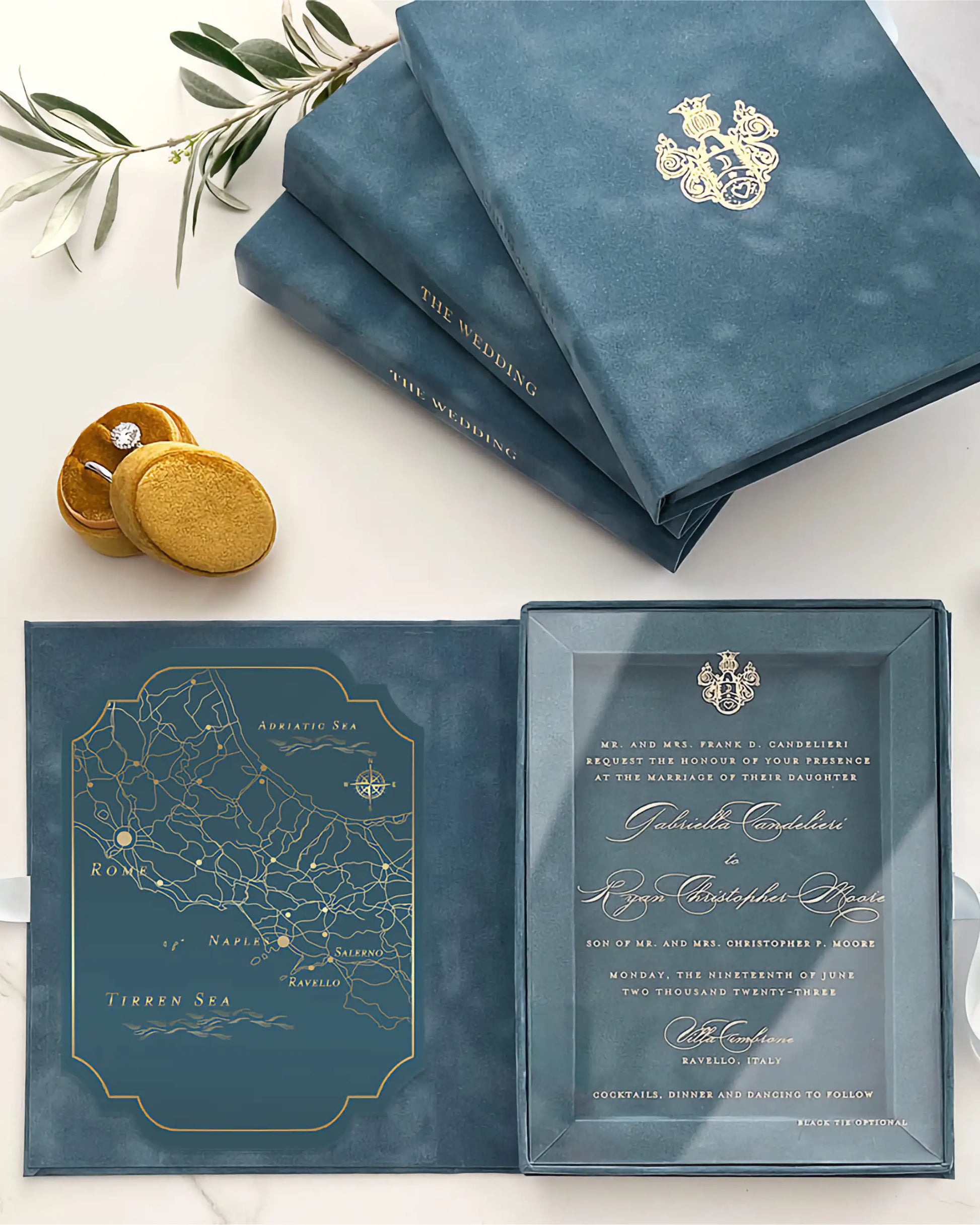 Dusty Blue wedding invitation set with gold details on a white surface