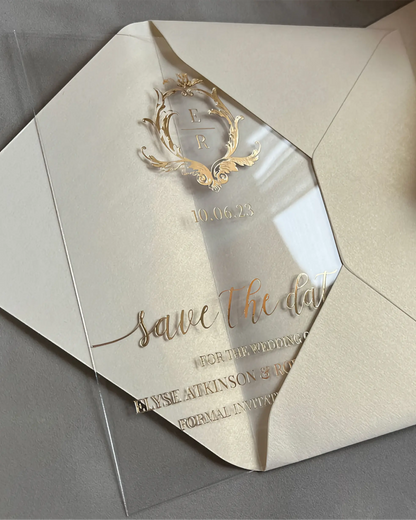 Isabelle Save the Date octagon clear acrylic card with gold foil crest on cream envelope — Polina Perri
