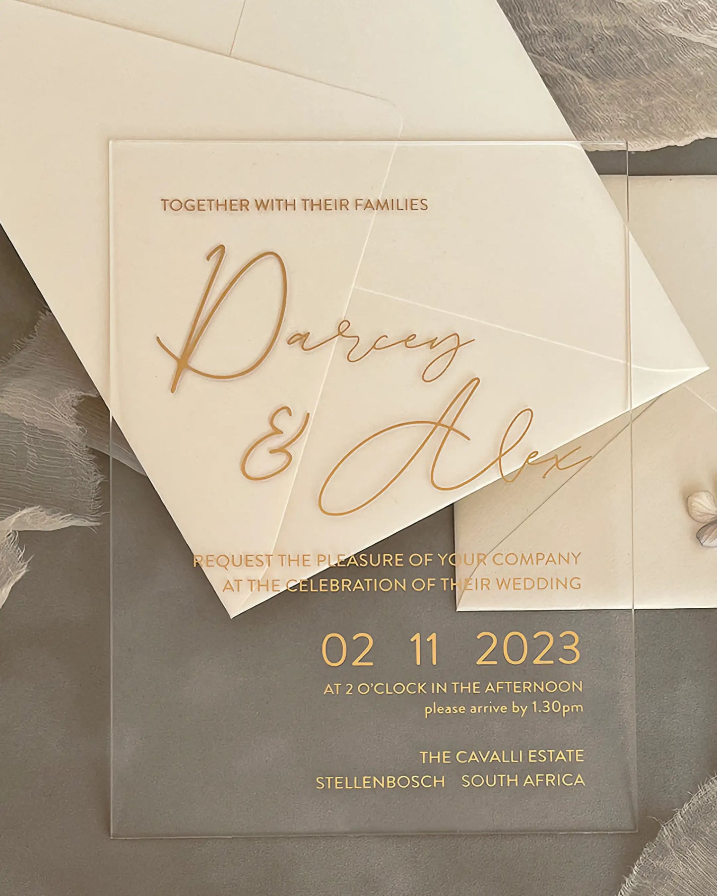 Modern Chic Acrylic wedding invitation with gold foil names and cream envelope flat lay — Polina Perri