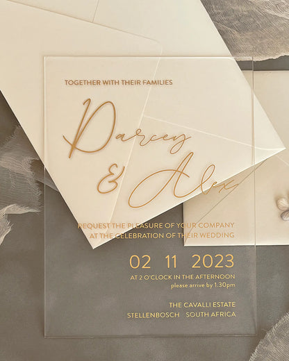 Modern Chic Acrylic wedding invitation with gold foil names and cream envelope flat lay — Polina Perri