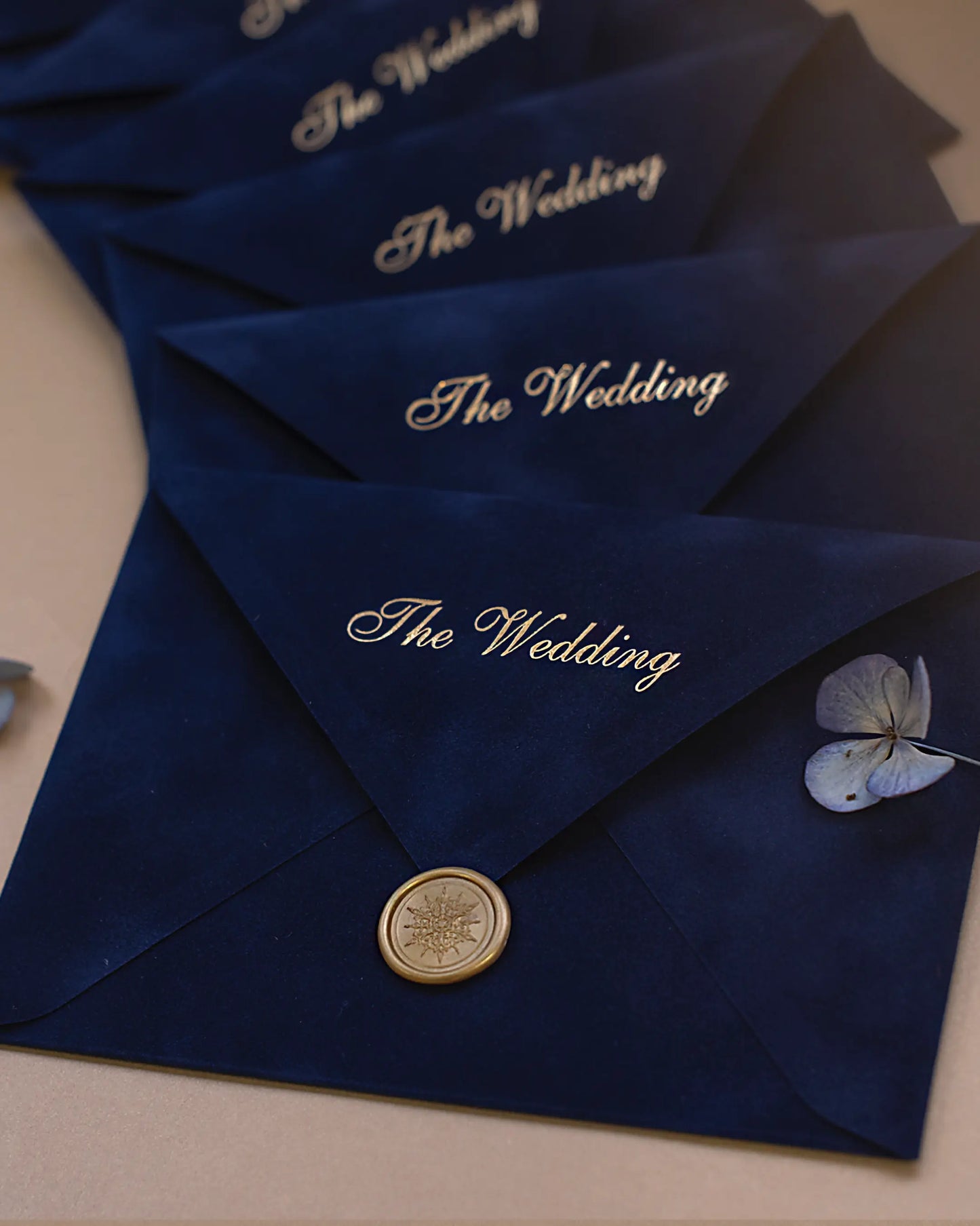 Navy Blue Velvet Wedding Envelopes with gold script addressing and gold wax seal — Polina Perri