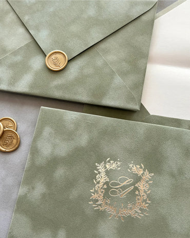 Sage Green velvet envelopes with gold wax seal and foil monogram wreath close-up — Polina Perri