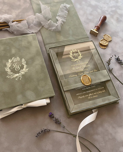 Sage Green Velvet Boxed Wedding Invitation suite with gold foil stamped monogram on box cover, gold wax seal, and dried lavender decor — Polina Perri