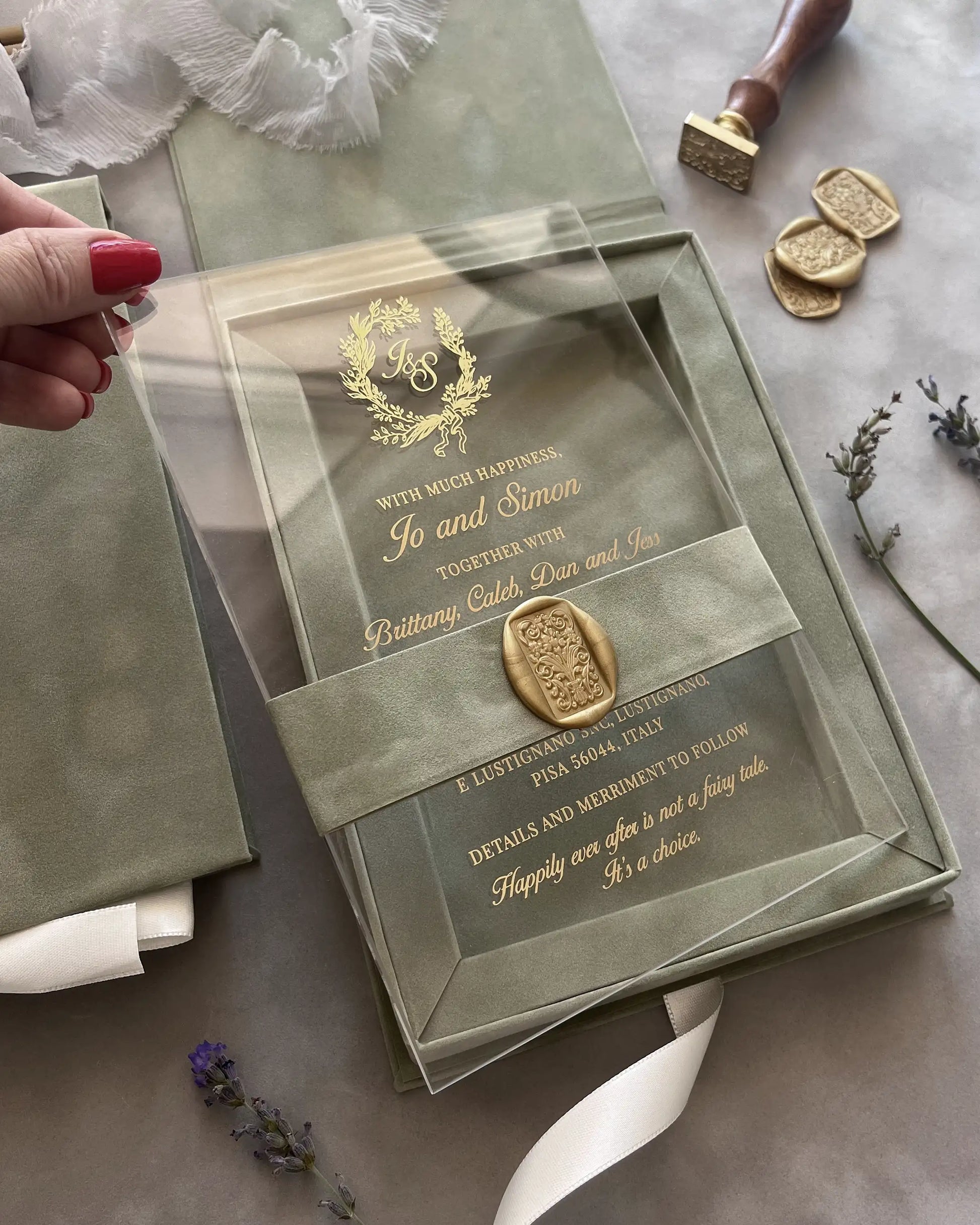 Sage Green Velvet Boxed wedding invitation clear acrylic card with elegant gold foil lettering held in hand close up — Polina Perri