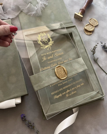 Sage Green Velvet Boxed wedding invitation clear acrylic card with elegant gold foil lettering held in hand close up — Polina Perri