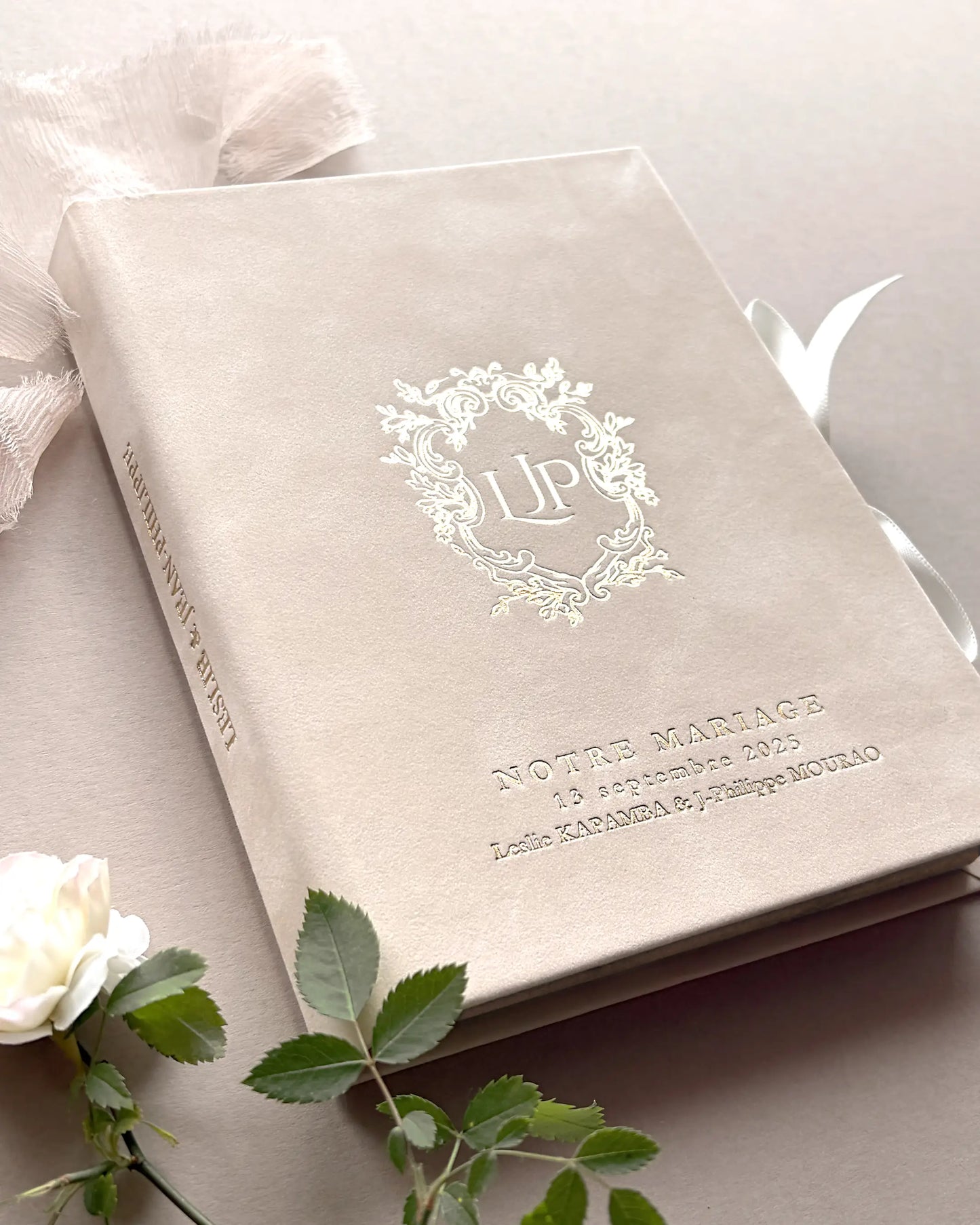 Close up of Vienna Blush Velvet wedding invitation box cover featuring a luxury gold foil stamped custom initials monogram and serif typography — Polina Perri