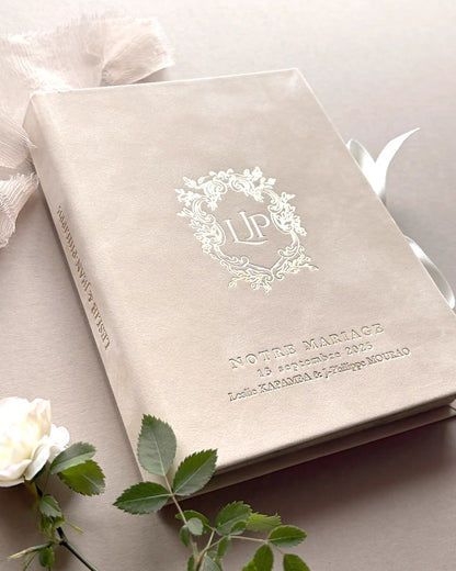 Close up of Vienna Blush Velvet wedding invitation box cover featuring a luxury gold foil stamped custom initials monogram and serif typography — Polina Perri