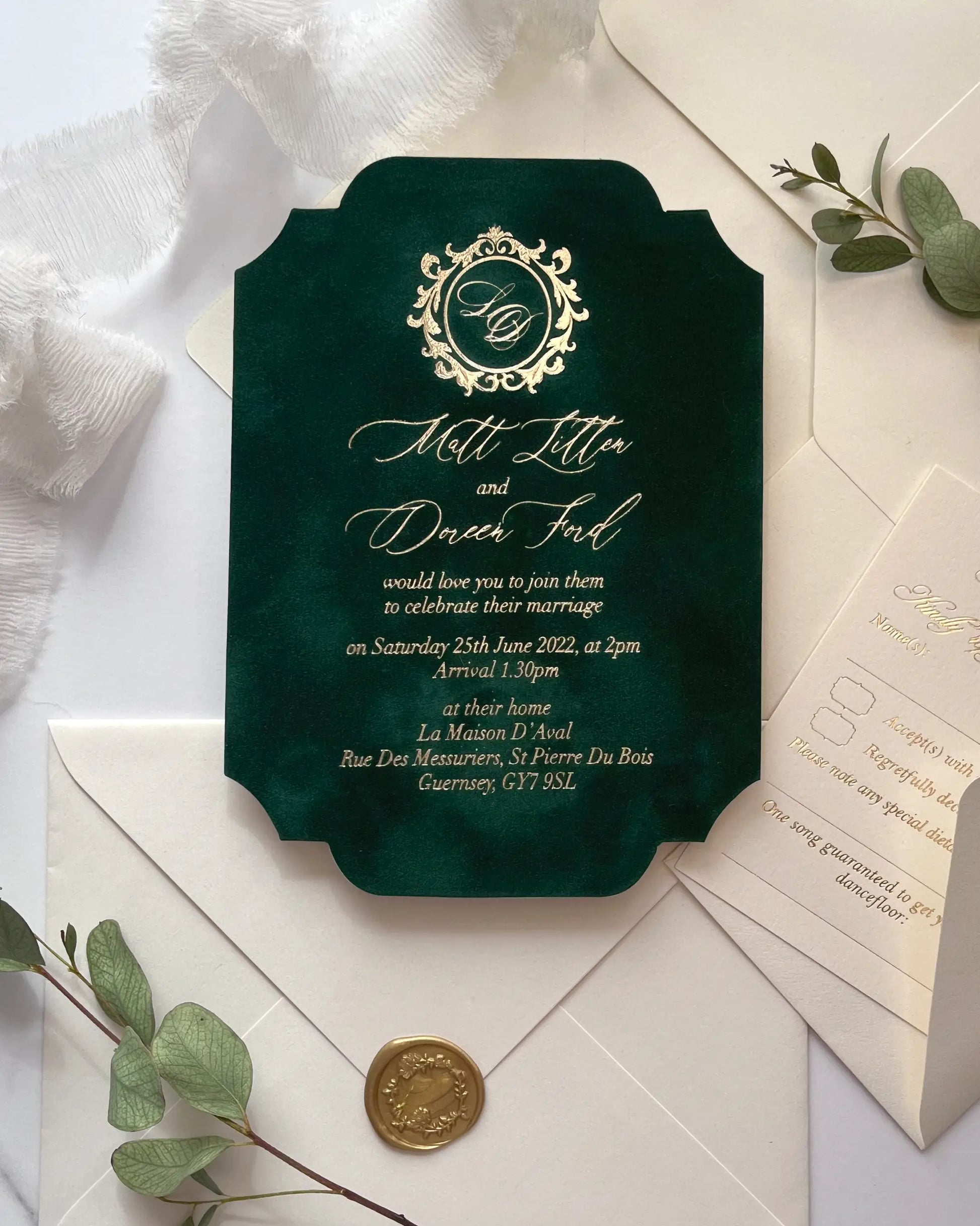 Luxury vintage forest green velvet wedding invitation with an ornate gold foil crest monogram and elegant serif typography on an ivory textured paper envelope — Polina Perri
