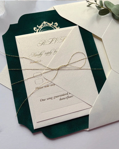 Forest green velvet wedding invitation card paired with an ivory paper RSVP card, elegantly bundled together with a fine gold thread bow — Polina Perri