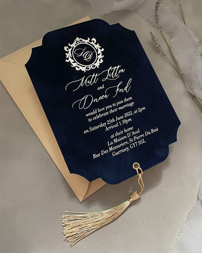 Deep navy blue velvet wedding invitation card with custom gold foil lettering and an elegant decorative gold silk tassel attachment — Polina Perri